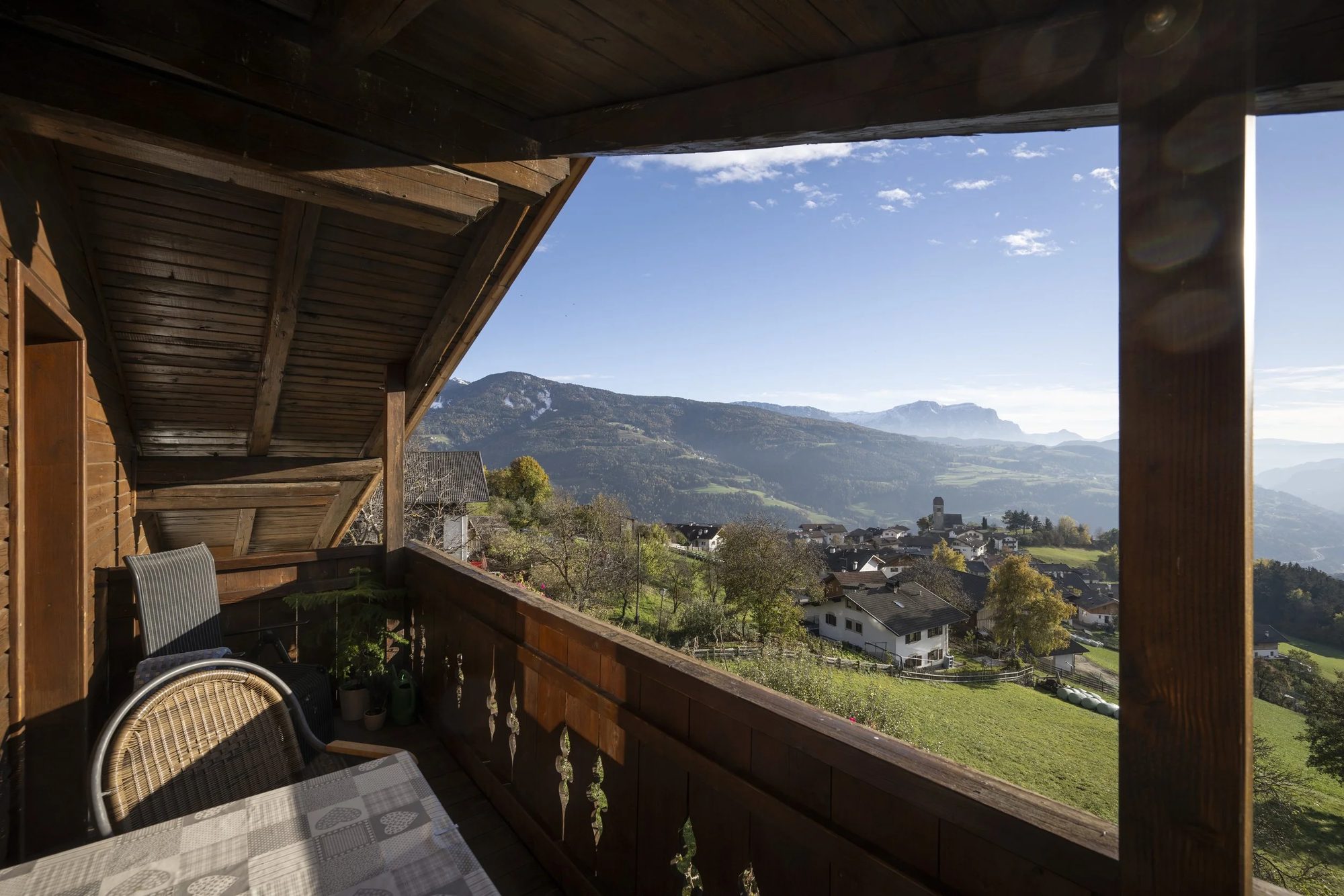 View from a wooden balcony overlooking the valley